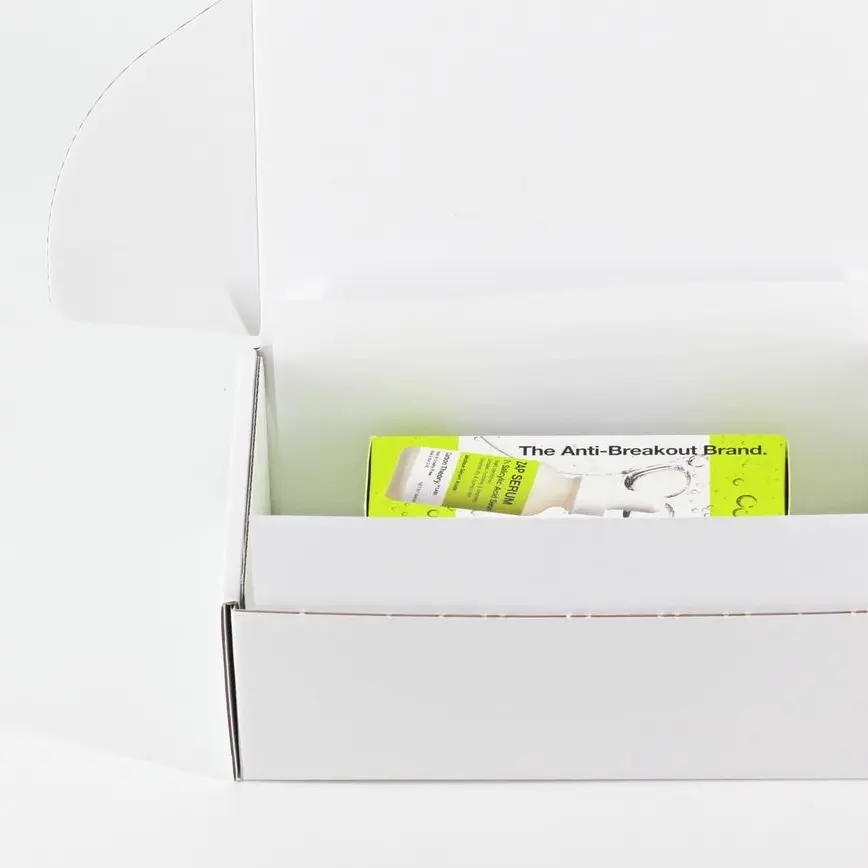 White paper retention pack with cosmetics products inside